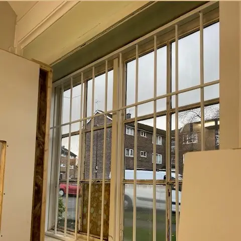 Metal security bars installed on a window in Sheffield, by DT Services Ltd