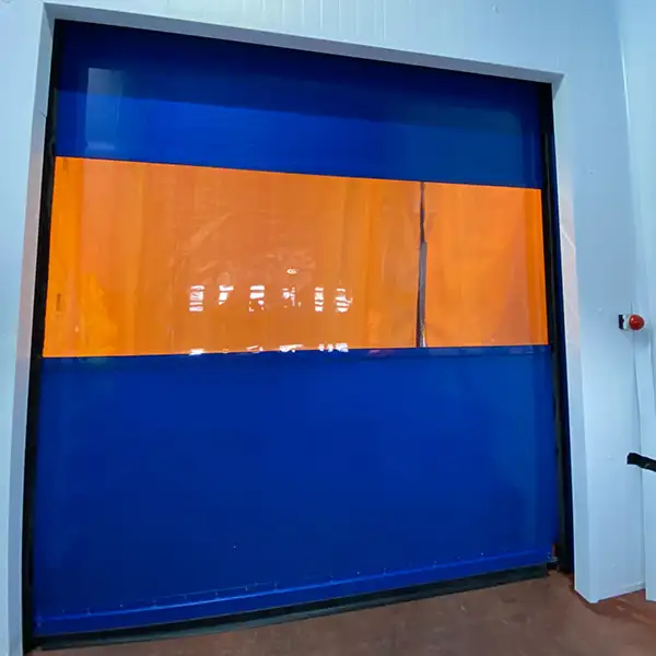 A blue and orange high-speed door, installed at Cranswick Foods in Hull
