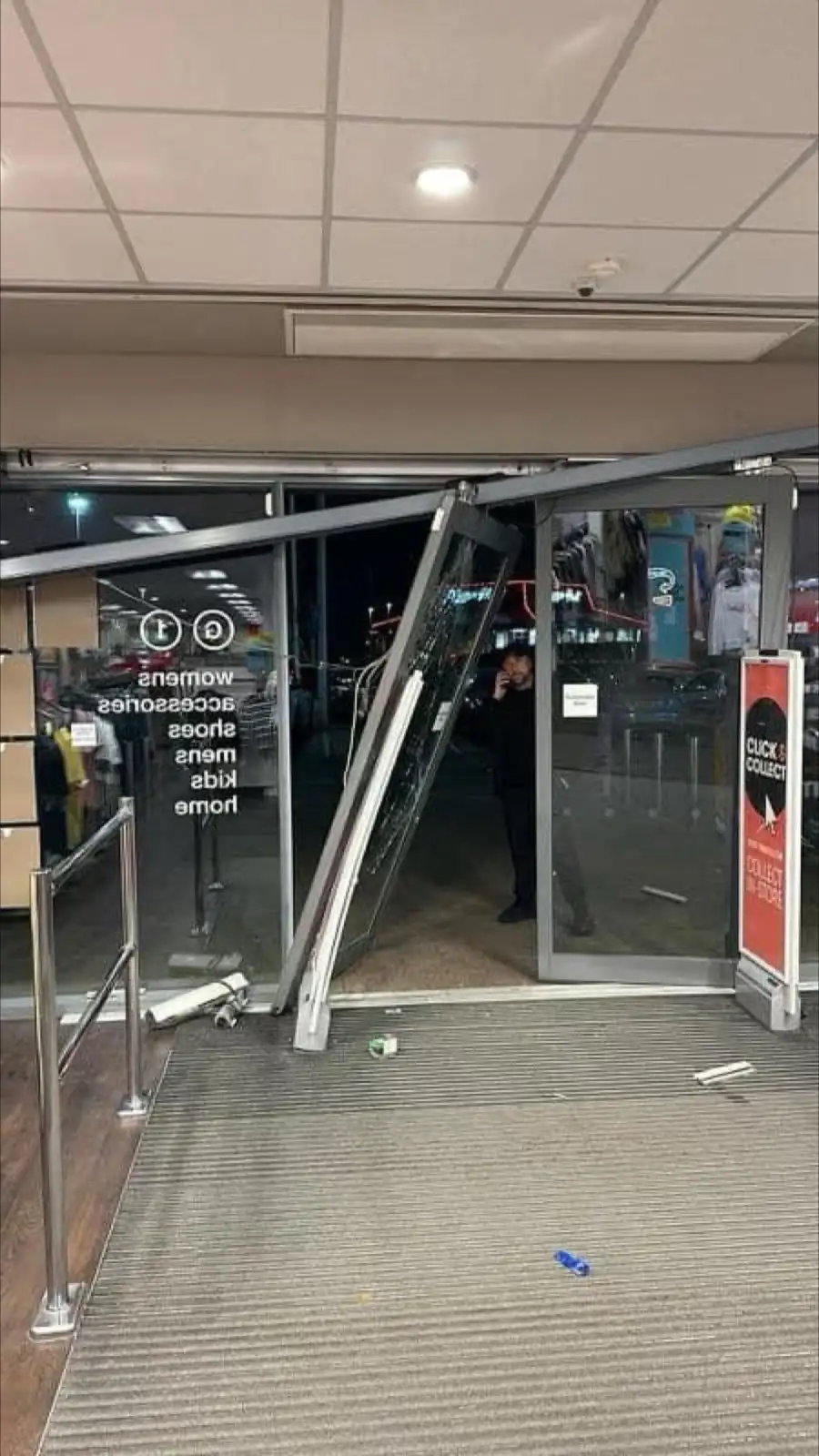 A damaged shop front entrance in Hull