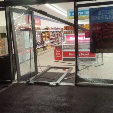 A damaged shop front in Hull, replaced by DT Services